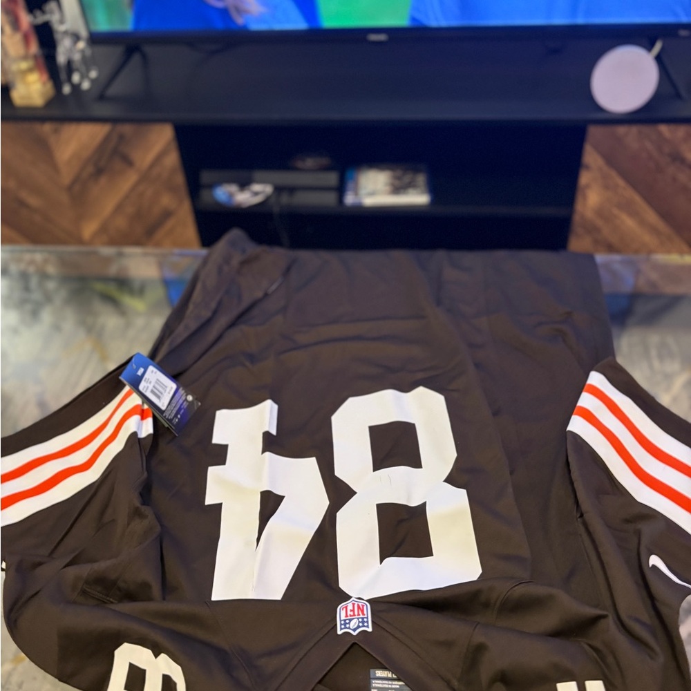 Brown Football Jersey with White and Orange Stripes